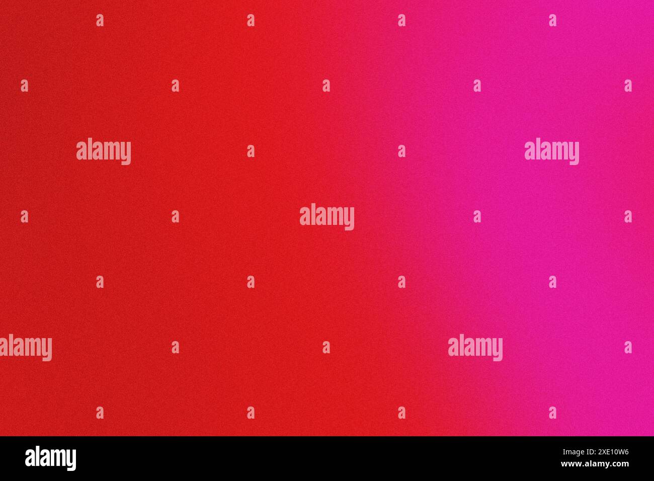Grainy textured background featuring a smooth gradient transition from red to pink Stock Photo