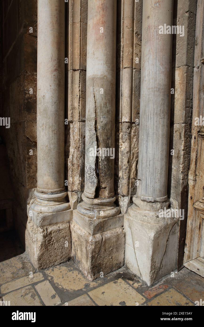 Cracked column holy to Orthodox entry to Holy Sepulcher, through the crack Holy Fire came out once in 16th century when ceremony was held by Armenians Stock Photo