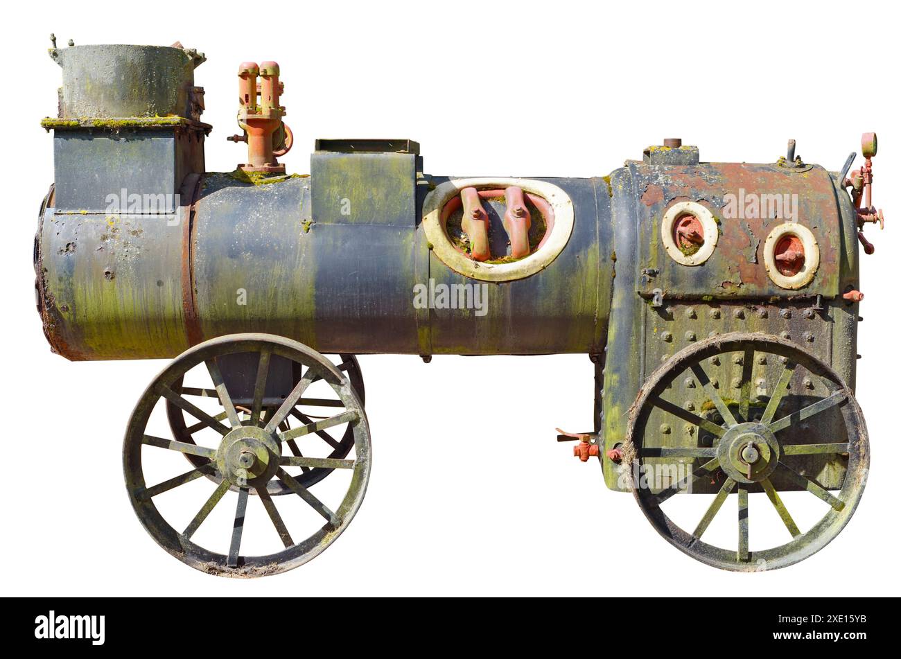 An ancient very small steam locomotive used in agriculture a hundred years ago isolated Stock Photo