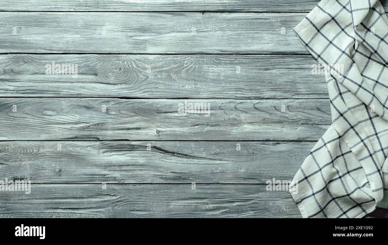 Gray wooden table with kitchen napkin, flat lay Stock Photo