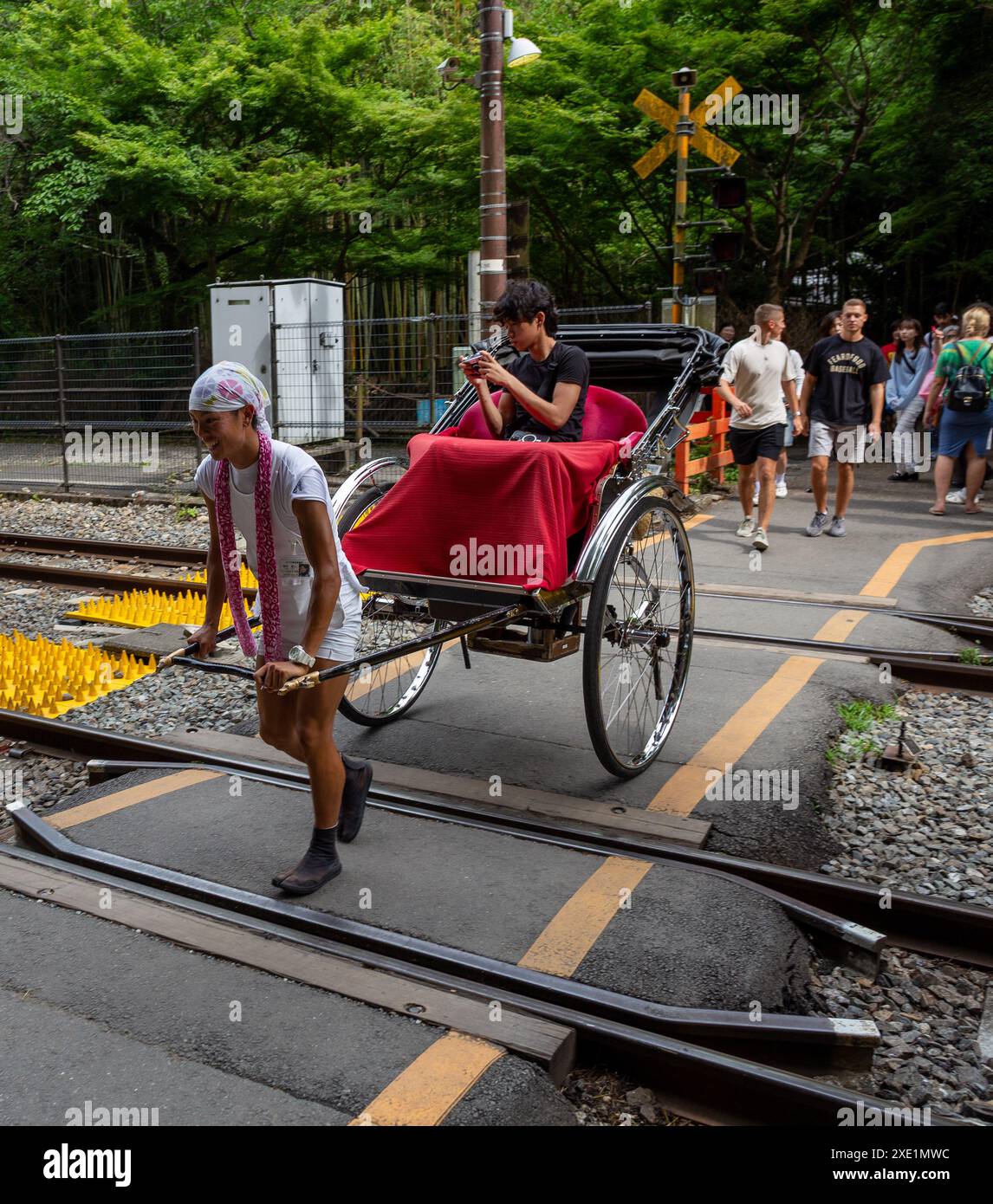 Tokyo, Japan. 25th June, 2024. A rickshaw rider pulls the Jinrikisha ...