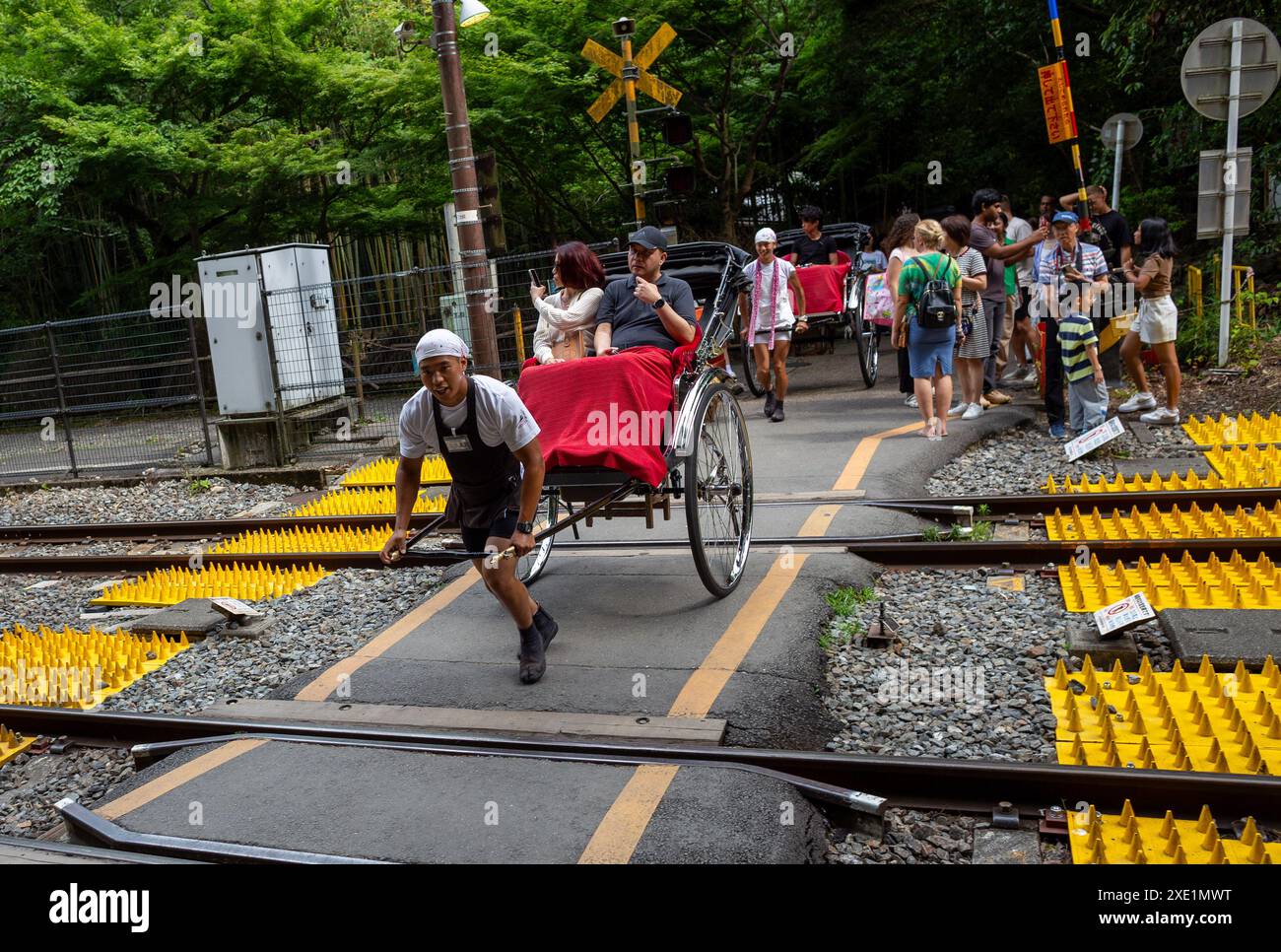 Tokyo, Japan. 25th June, 2024. A rickshaw rider pulls the Jinrikisha ...