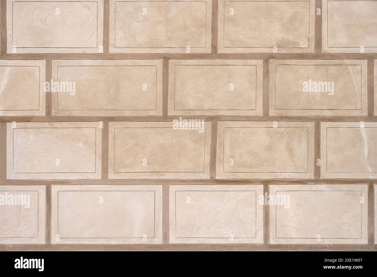 Background from a wall with rectangular beige stone slabs Stock Photo