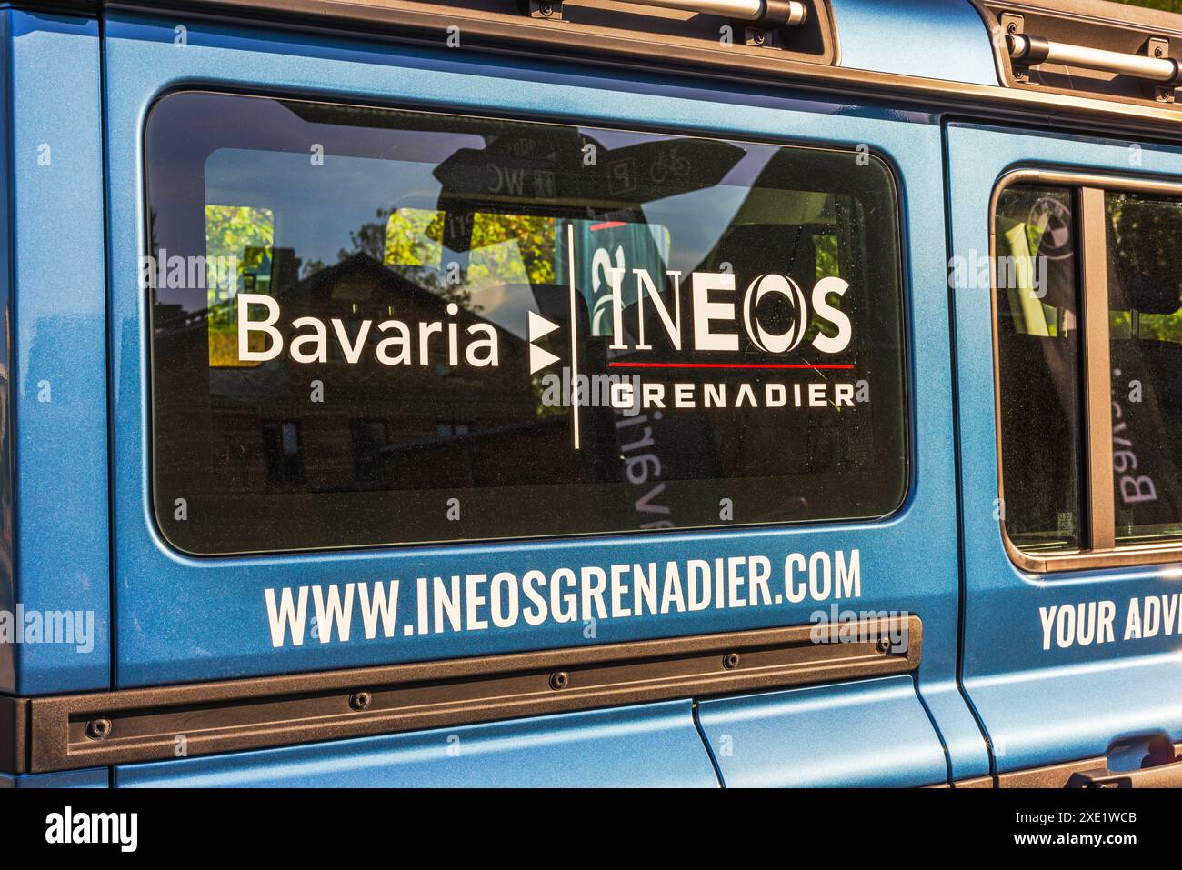 Close-up view of various advertisements on the windows of the new INEOS Grenadier SUV. Stock Photo