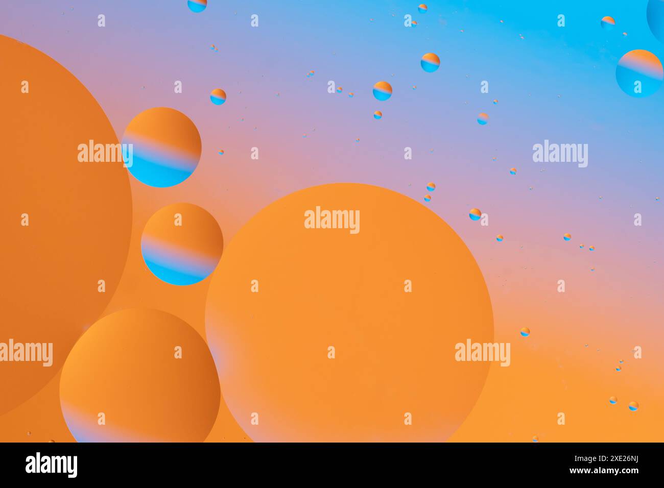 Colorful circles floating on a gradient background Stock Photo