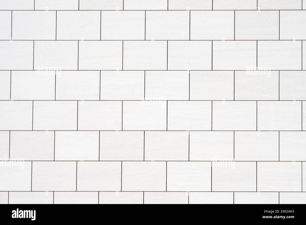 Background from a wall with rectangular white stone slabs Stock Photo