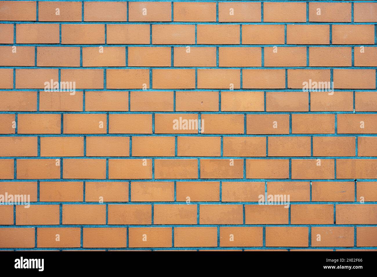Background from a wall made of orange clinker bricks Stock Photo