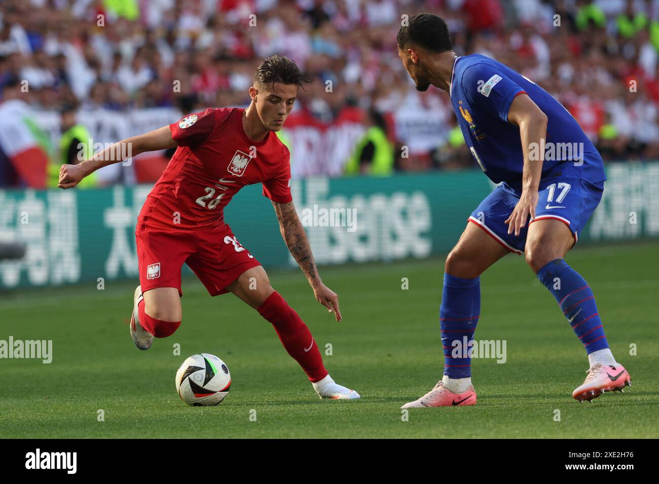 Dortmund , Germany 25.06.2024: Kacper Urbański of Poland, William Saliba of France during the UEFA EURO 2024 Matchday 3, group stage D football match Stock Photo