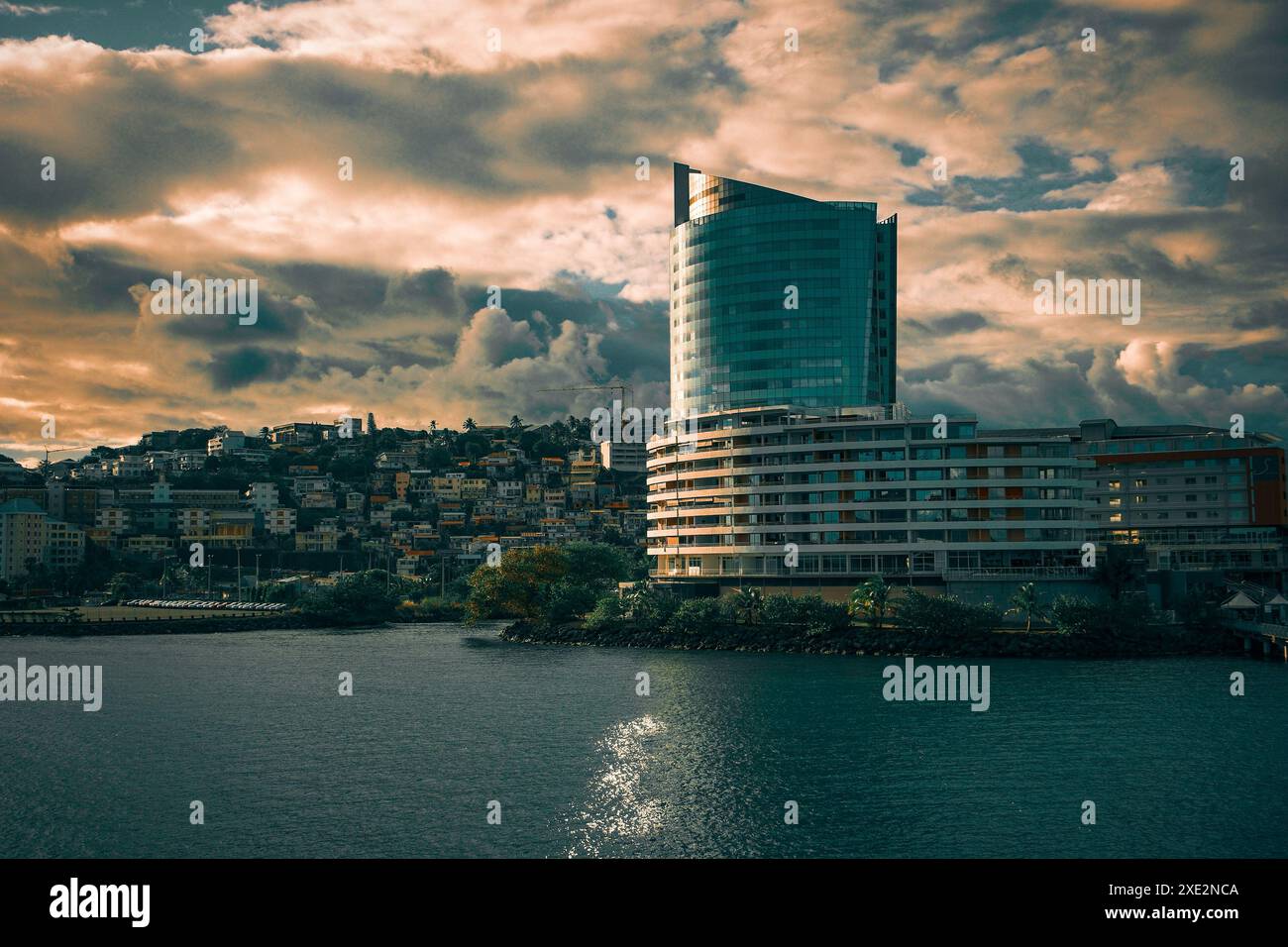 Fort-de-France, Martinique as the sun starts to set behind the hills surrounding the city. Stock Photo