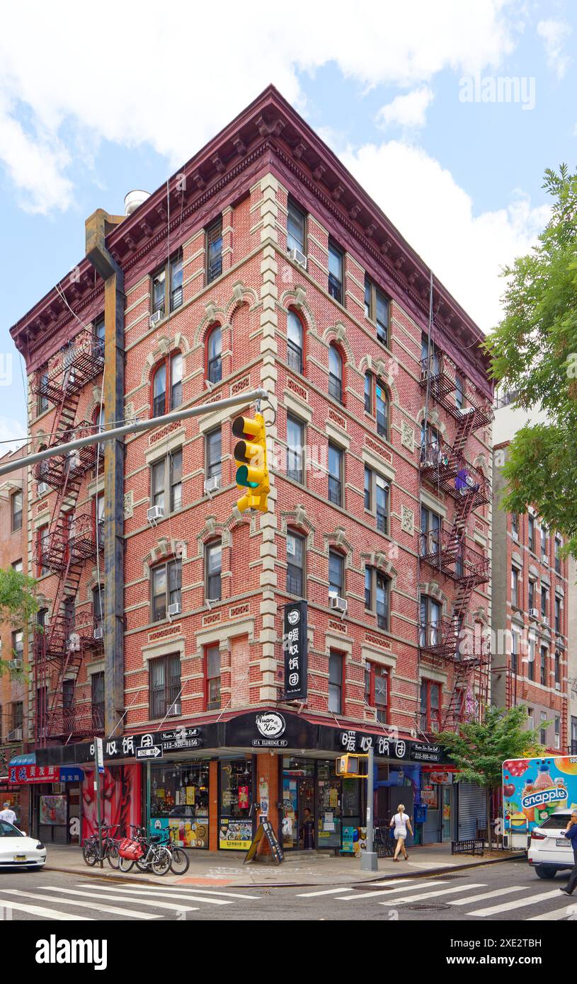 NYC Chinatown: 67 Eldridge Street (corner of Hester Street) is a brick  apartment building and stores, painted red with white terra cotta trim  Stock Photo - Alamy