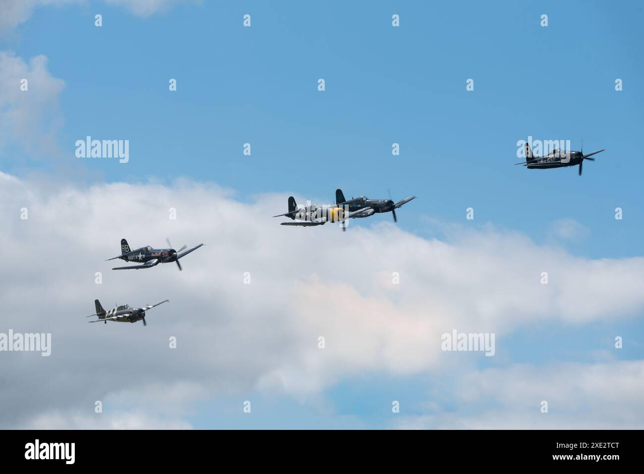 Formation of vintage Second World War Navy aircraft flying at the