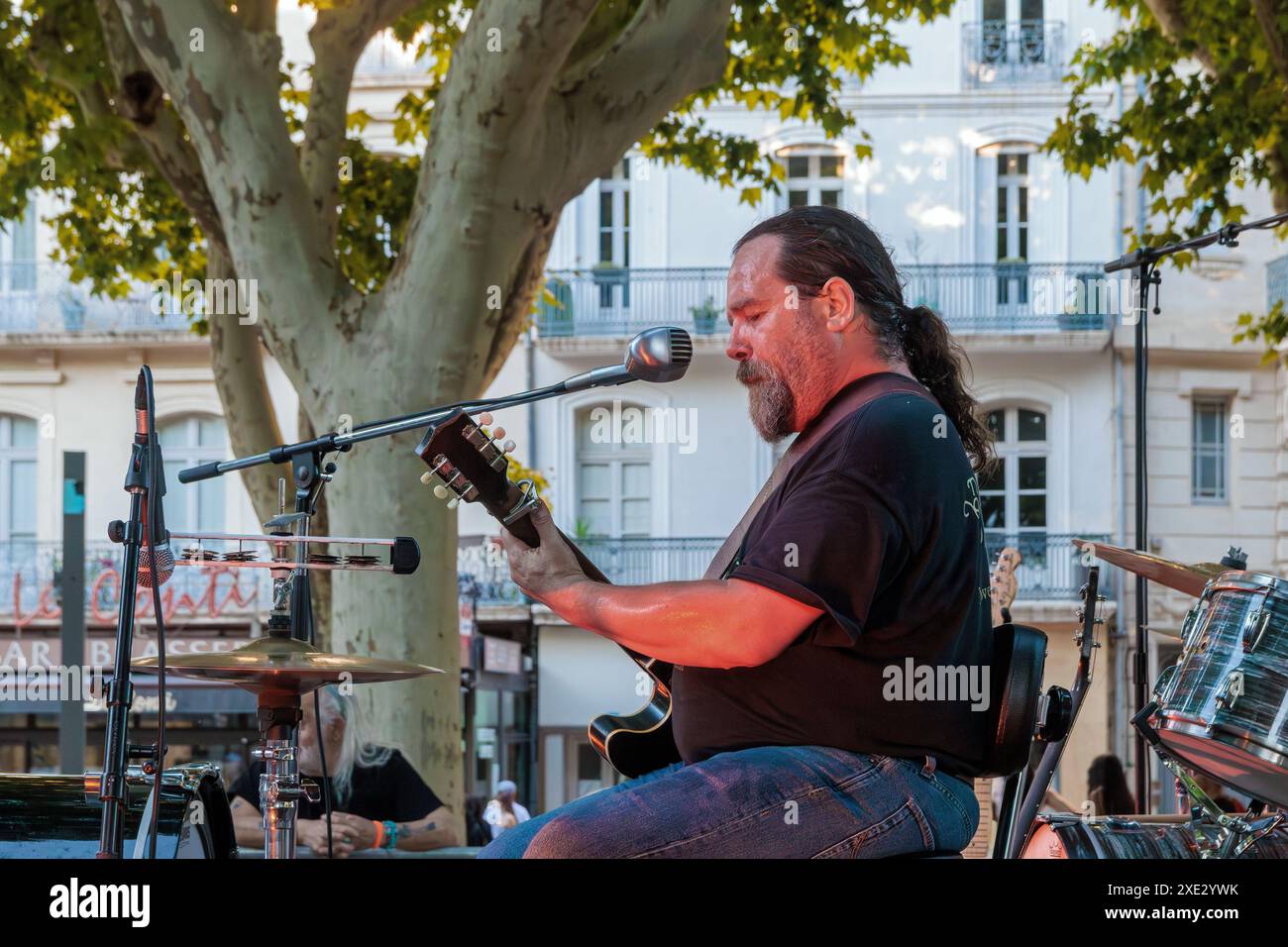 Olivier Mas in concert on the Allees Paul Riquet during the Fete de la Musique. Beziers, Occitanie, France Stock Photo