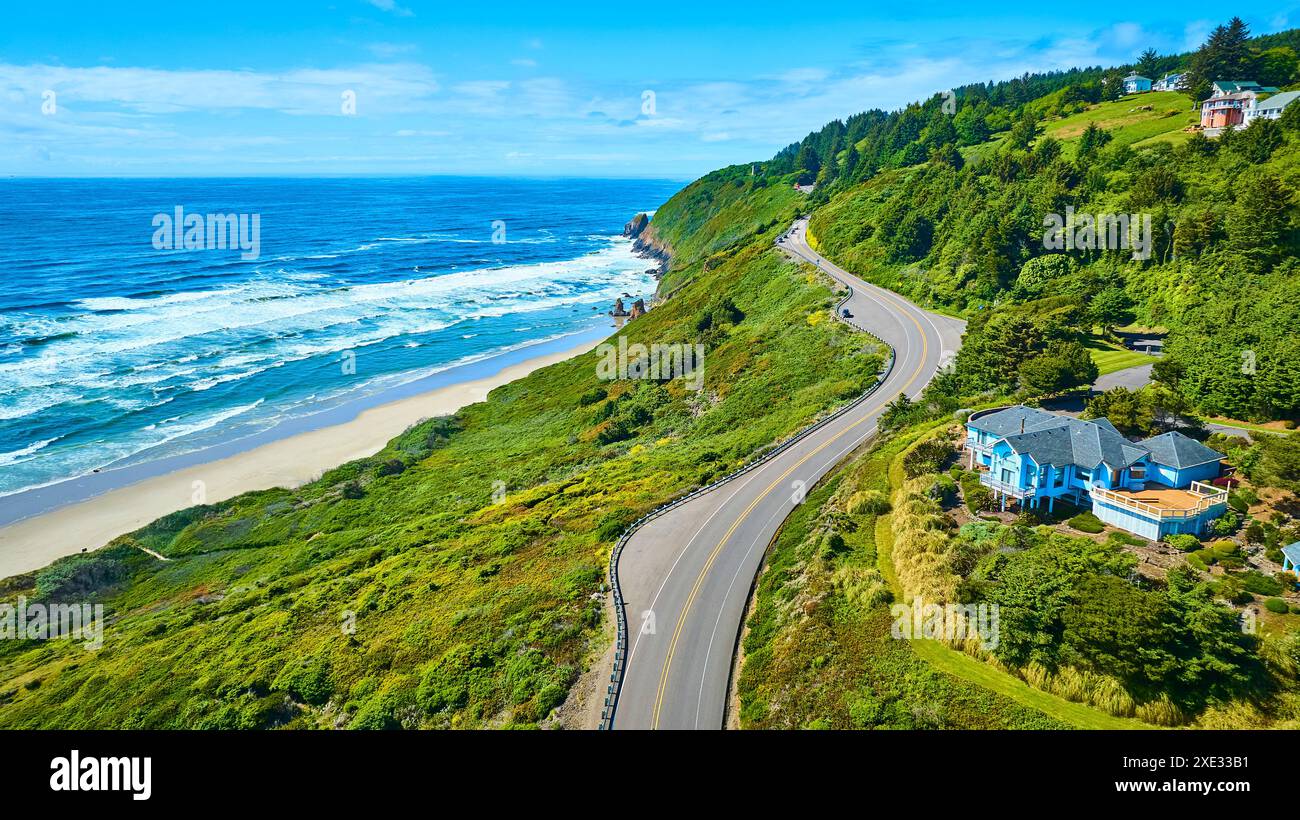 Aerial Coastal Road and Ocean with Hillside Homes in Oregon Stock Photo ...