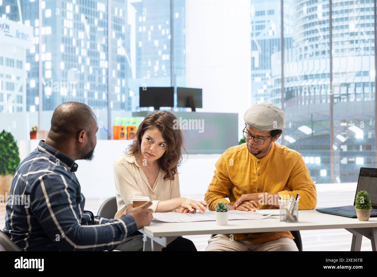 Brokers team and entrepreneur discussing a real estate potential ... - Entrepreneur Office Space Rental