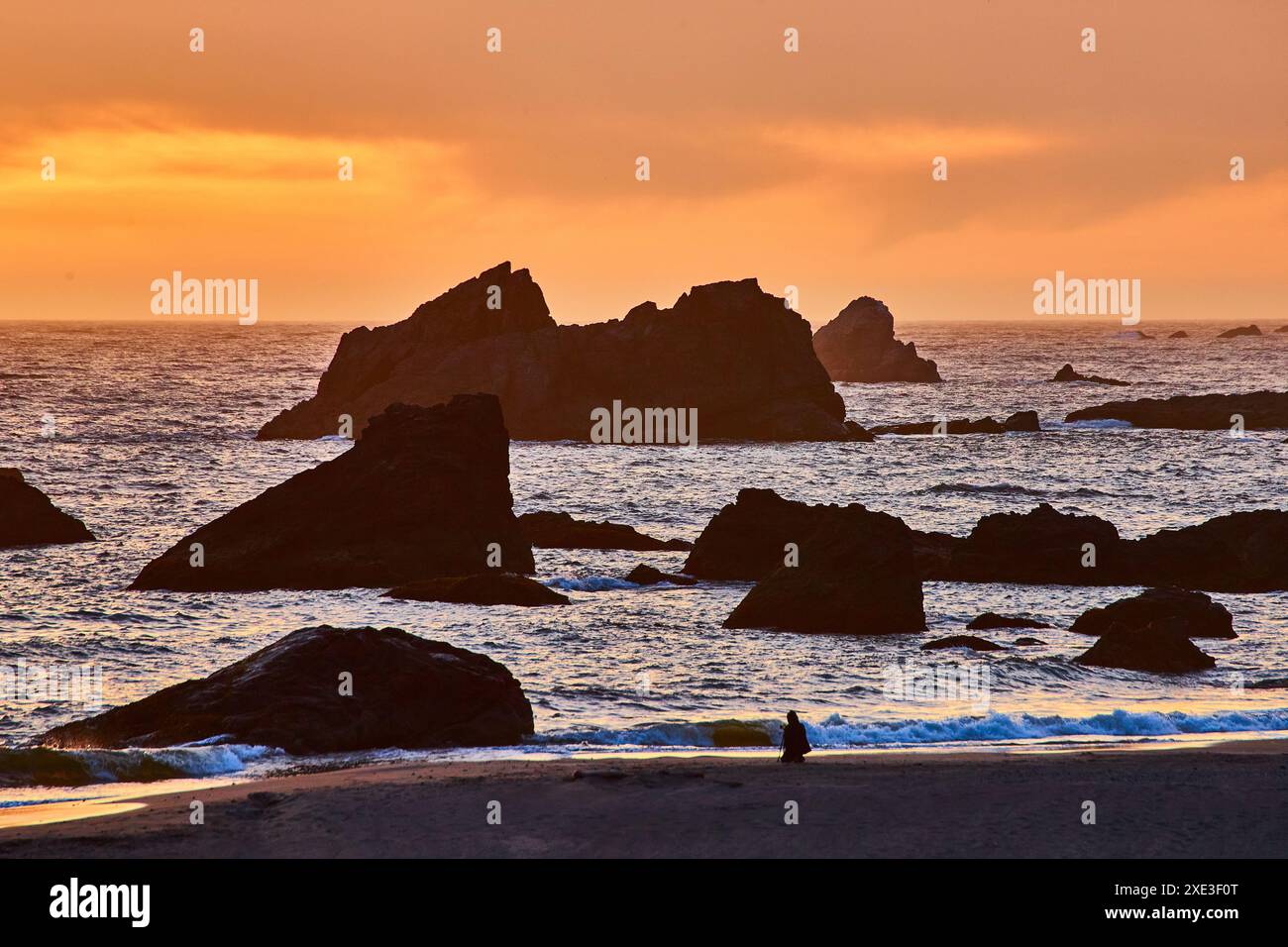 Sunset over rocky coastline hi-res stock photography and images - Alamy
