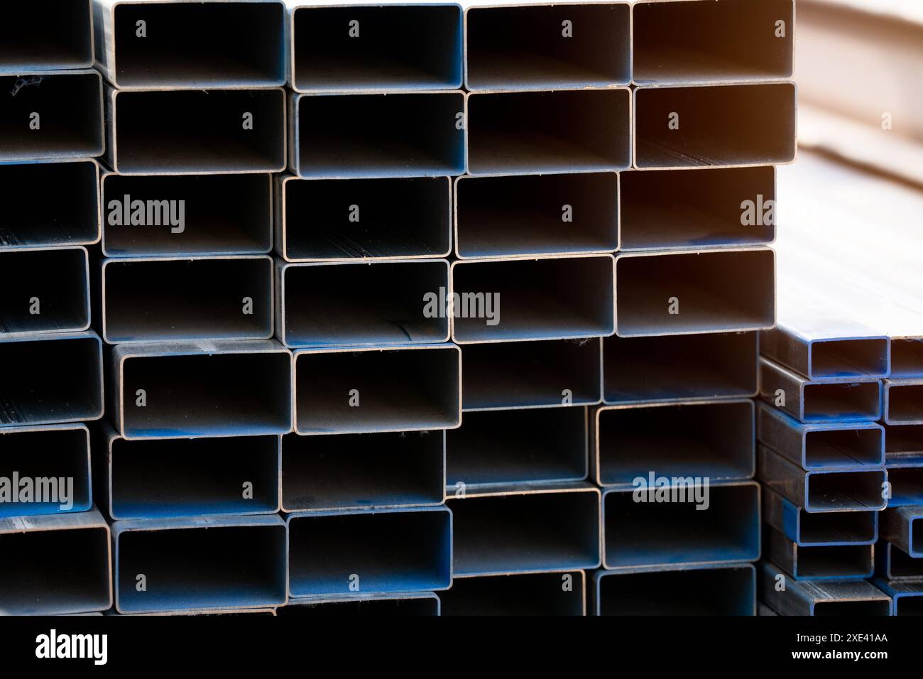 Industrial warehouse stock of rectangular metal pipes for building and ...