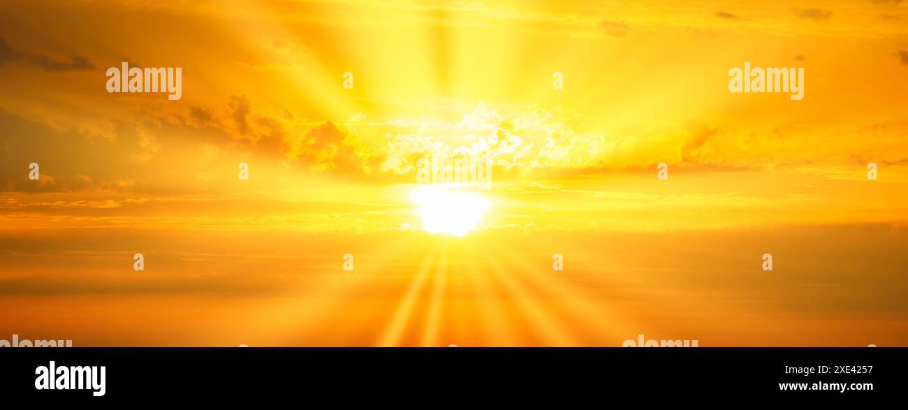 Sunset sky with sunset clouds and sun rays Stock Photo