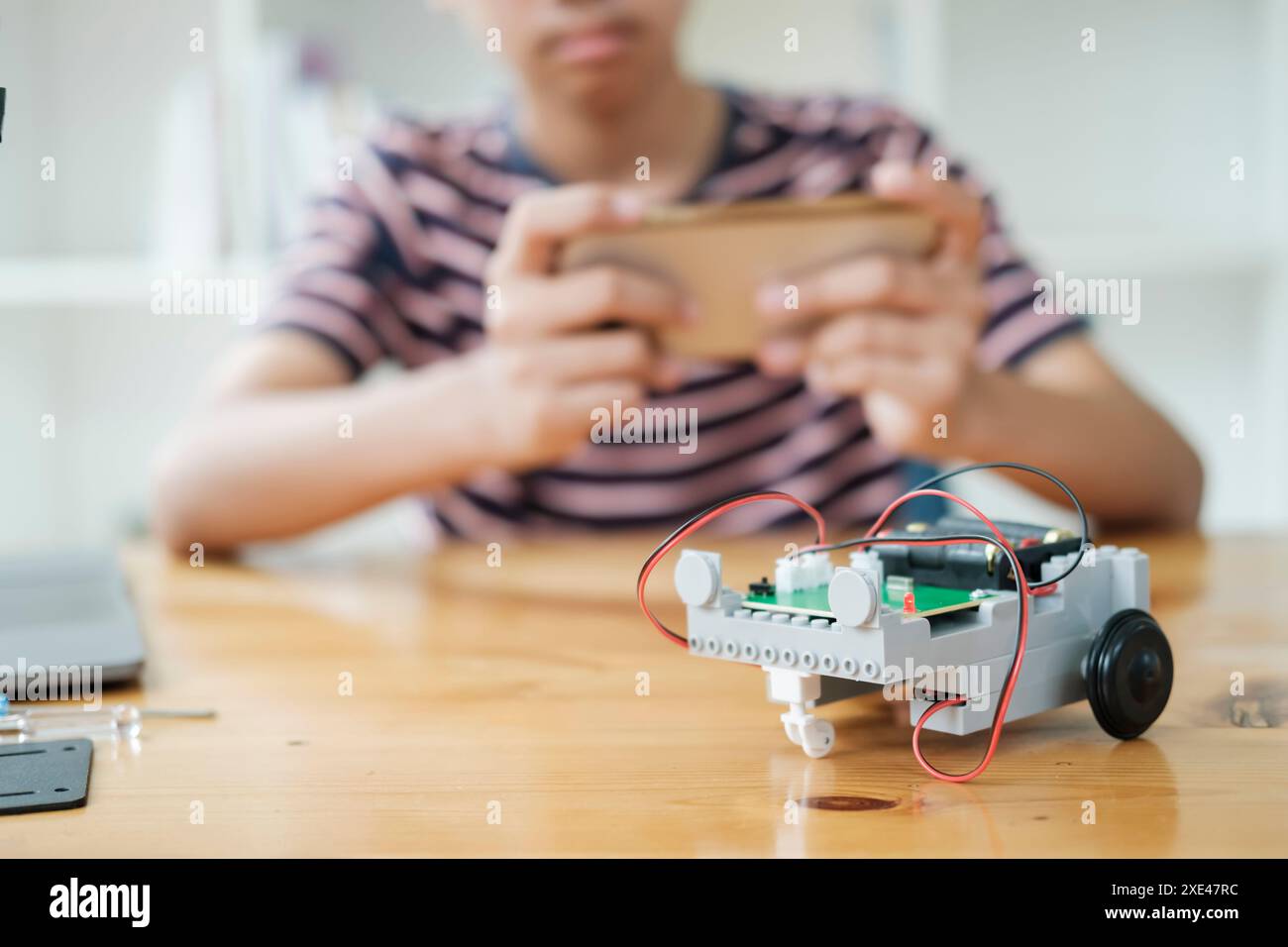Student doing robot project in science technology of robotics programing and STEM education concept. Stock Photo