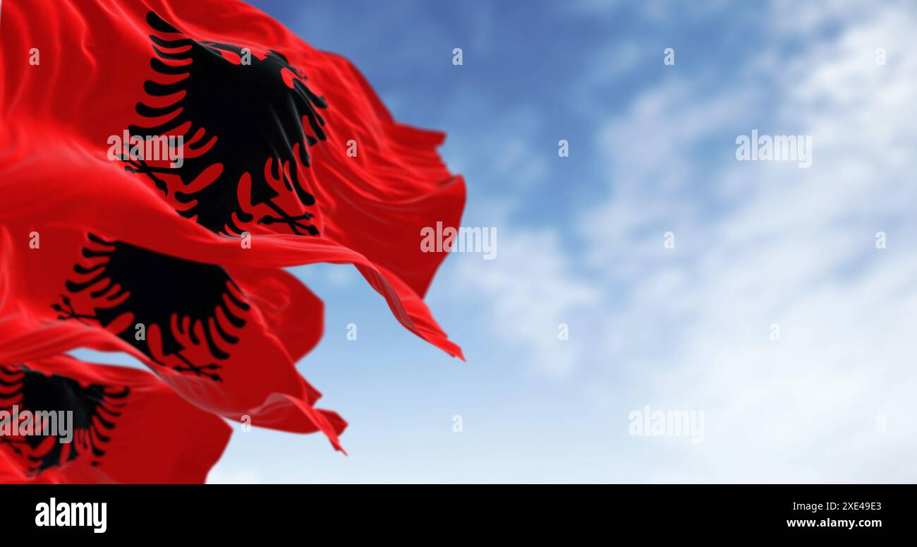 Albanian national flag waving in the wind on a clear day Stock Photo ...