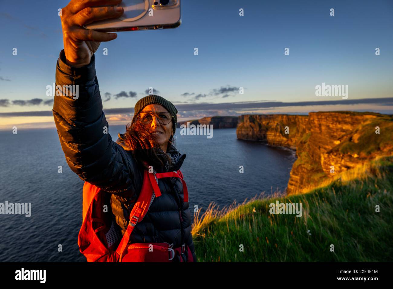 Female hiker taking a selfie Stock Photo - Alamy