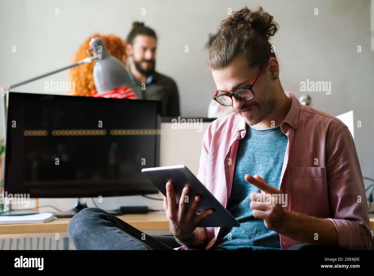 Software, coding and business woman on tablet thinking of data analytics, digital technology. Stock Photo