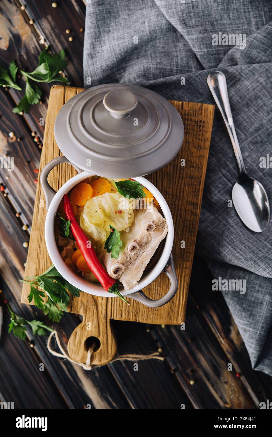 Pickled cabbage soup with carrots and pork ribs Stock Photo