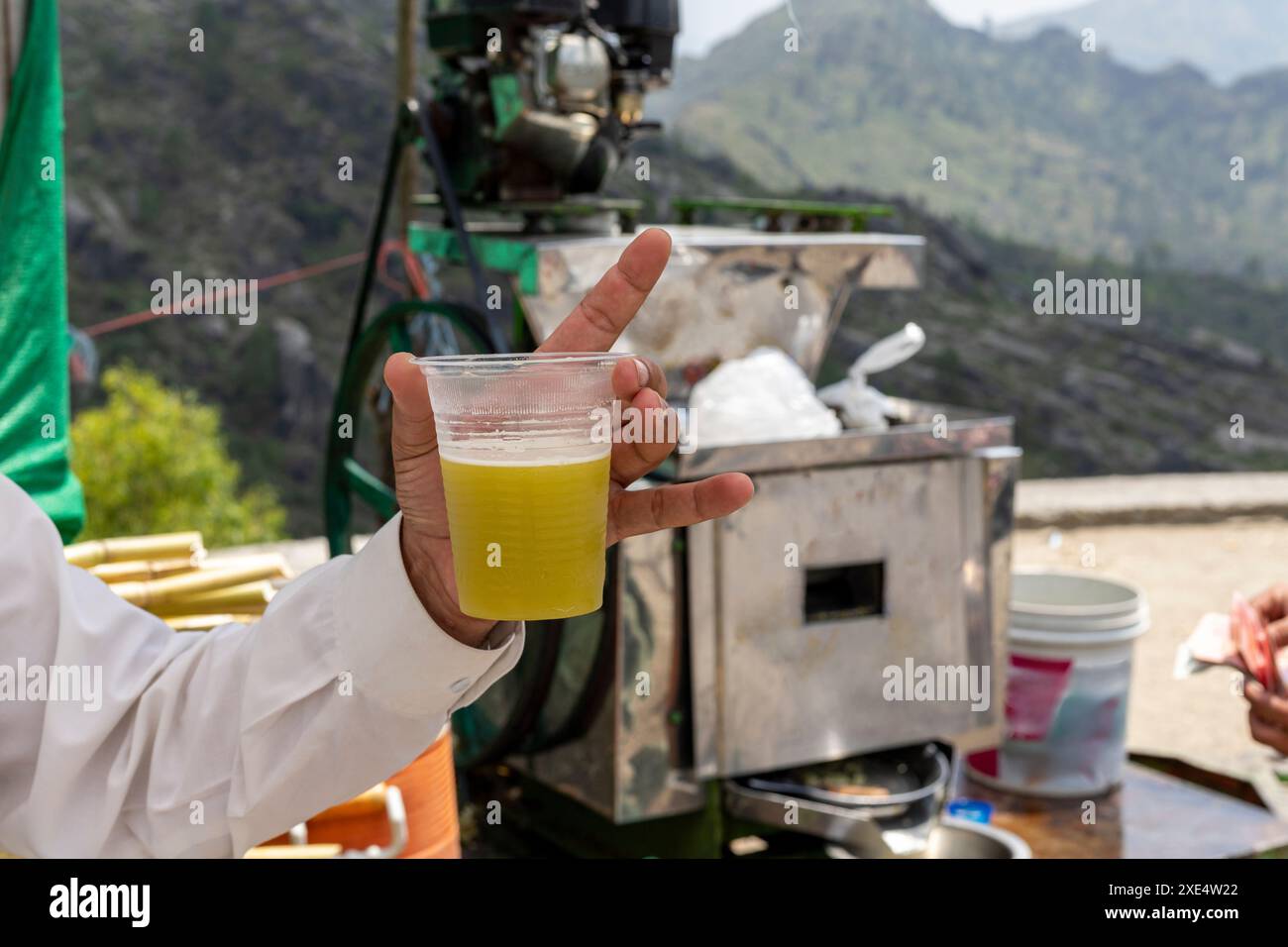 Freshly Squeezed Sugarcane Juice in Plastic Cup Stock Photo