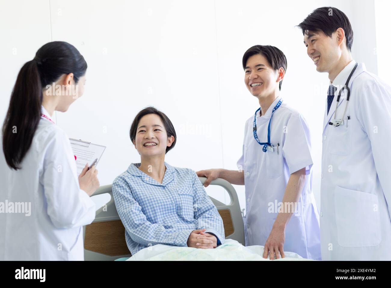 Medical team and patient Stock Photo - Alamy