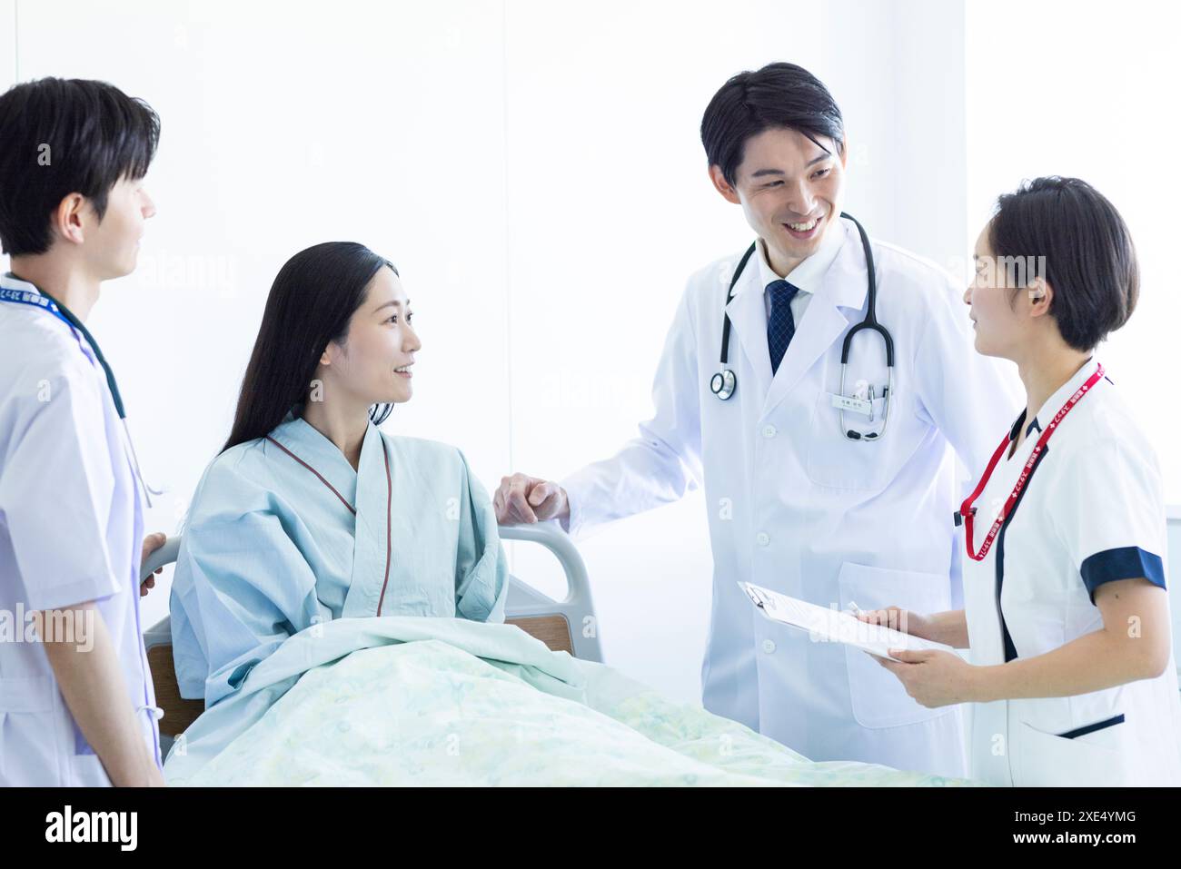 Medical team and patient Stock Photo - Alamy