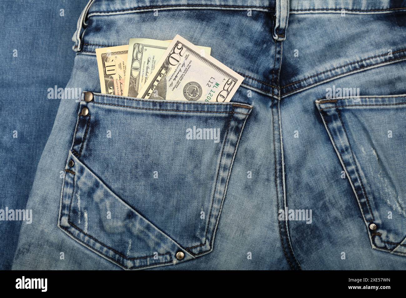 US dollar banknotes in jeans back pocket Stock Photo