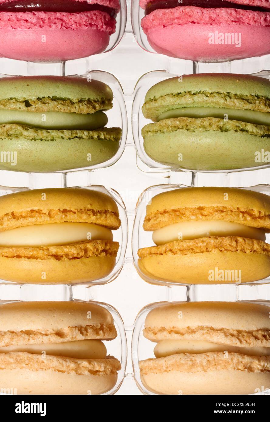 Macarons in plastic box on isolated background, top view Stock Photo