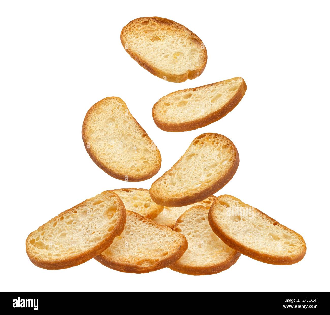 Falling bruschetta crackers, bread croutons isolated on white background Stock Photo