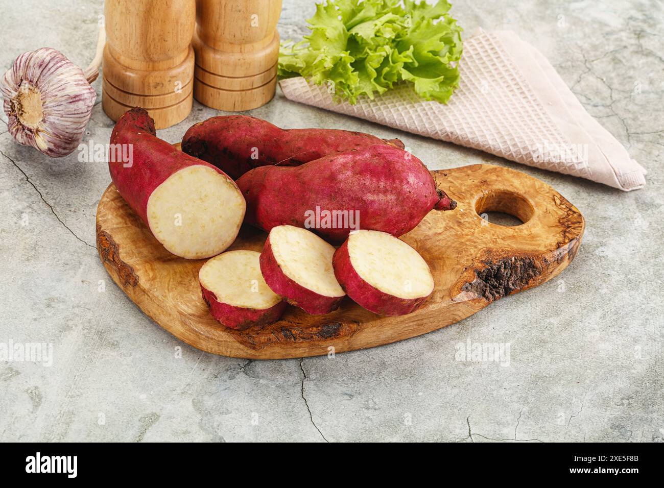 Raw red sweet batat with slices Stock Photo - Alamy