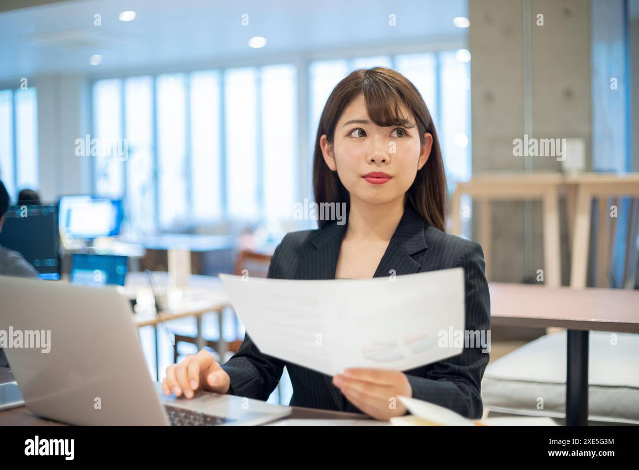 Asian businesswoman laptop documents hi-res stock photography and ...
