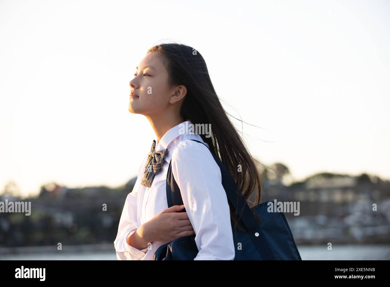 Schoolgirls in school uniform walking along the seaside Stock Photo - Alamy