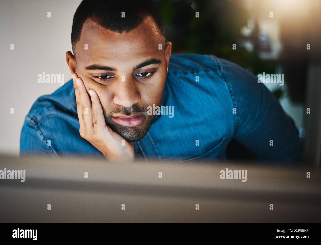Businessman, bored and tired with computer in workplace, problem solving and solution with decision at night. Working late, web designer and monitor Stock Photo