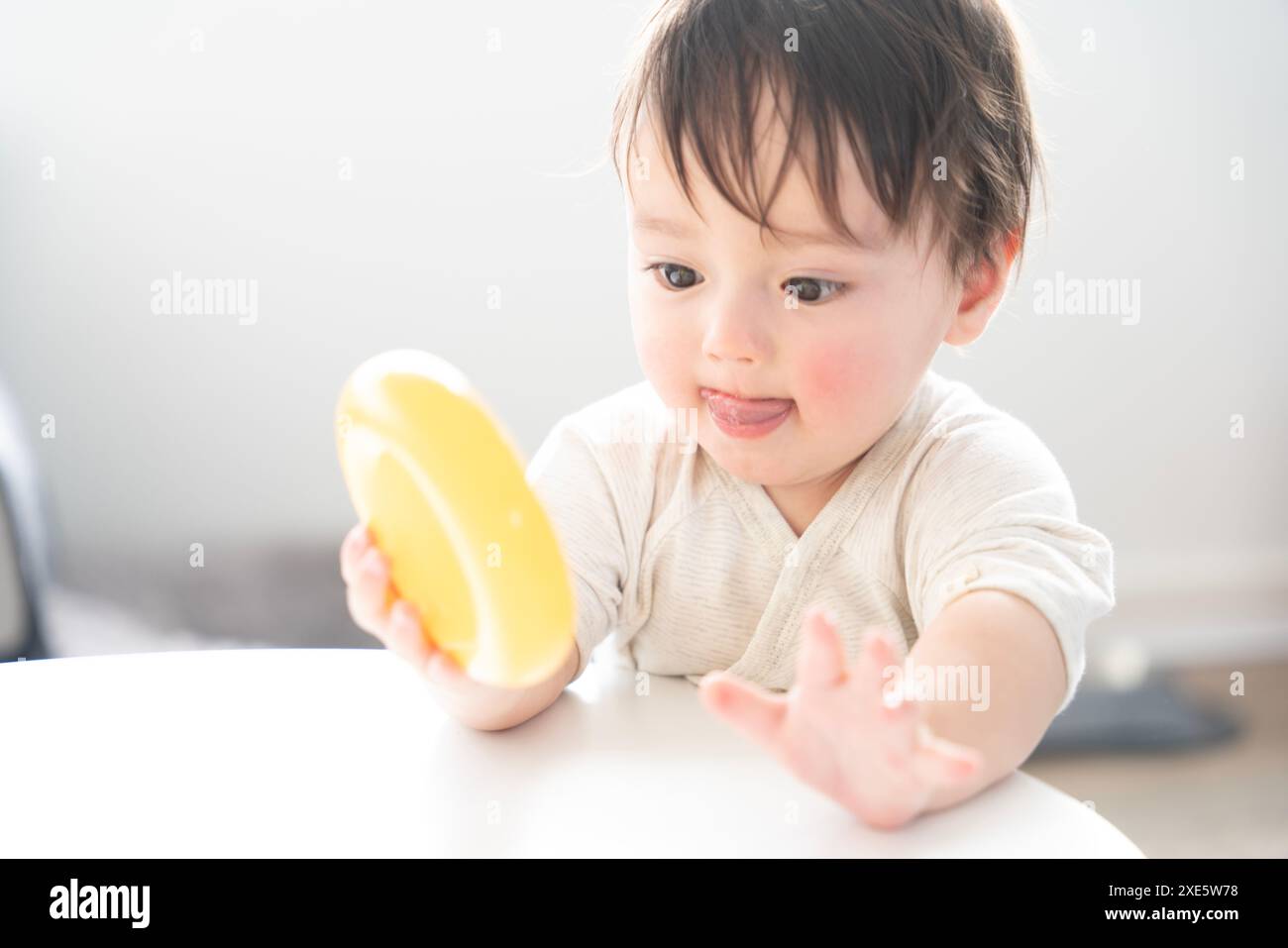 Baby boy playing with toys Stock Photo - Alamy