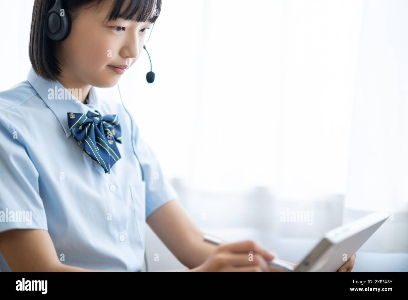 Student taking a class using a tablet Stock Photo