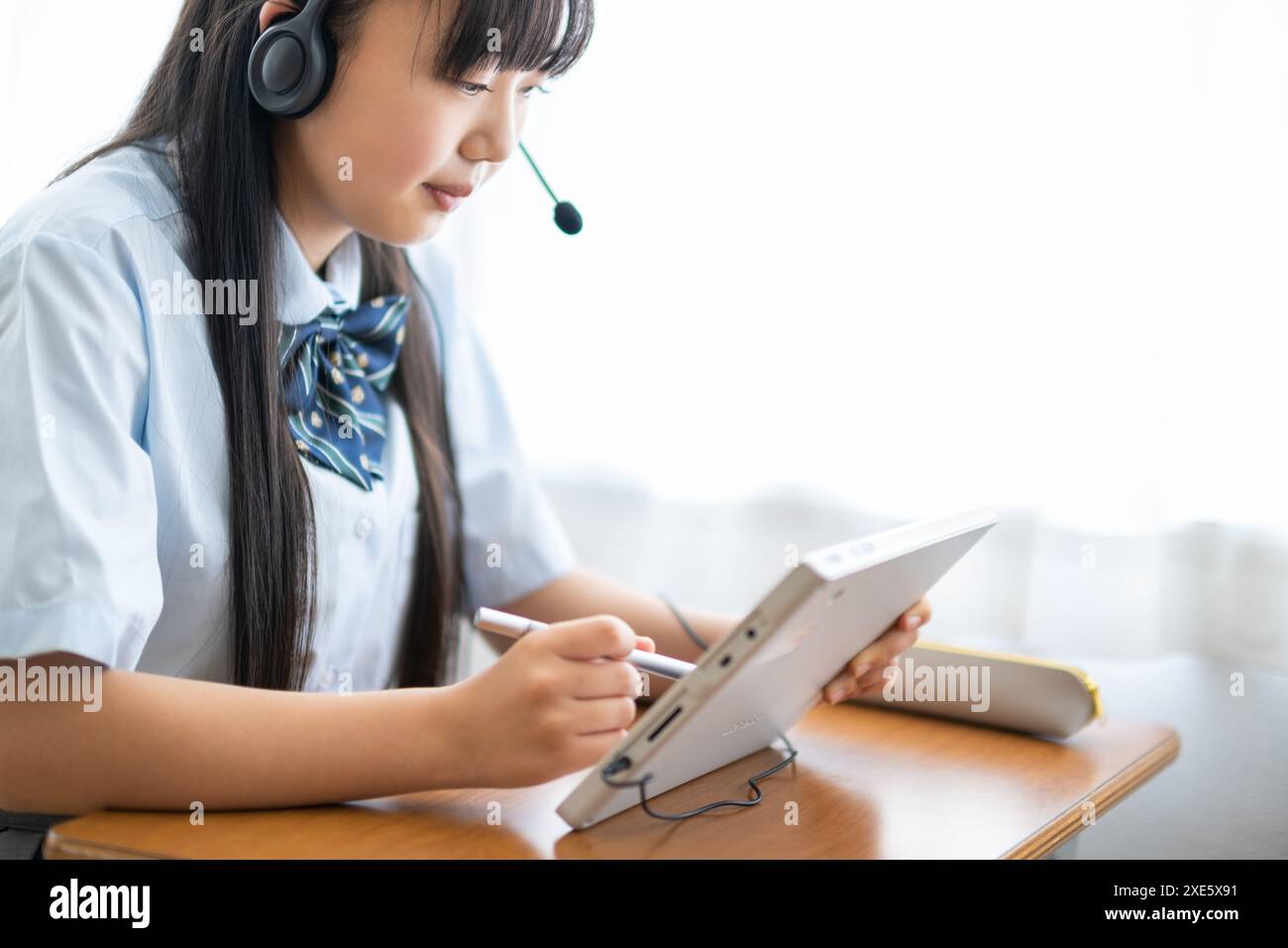 Student taking a class using a tablet Stock Photo