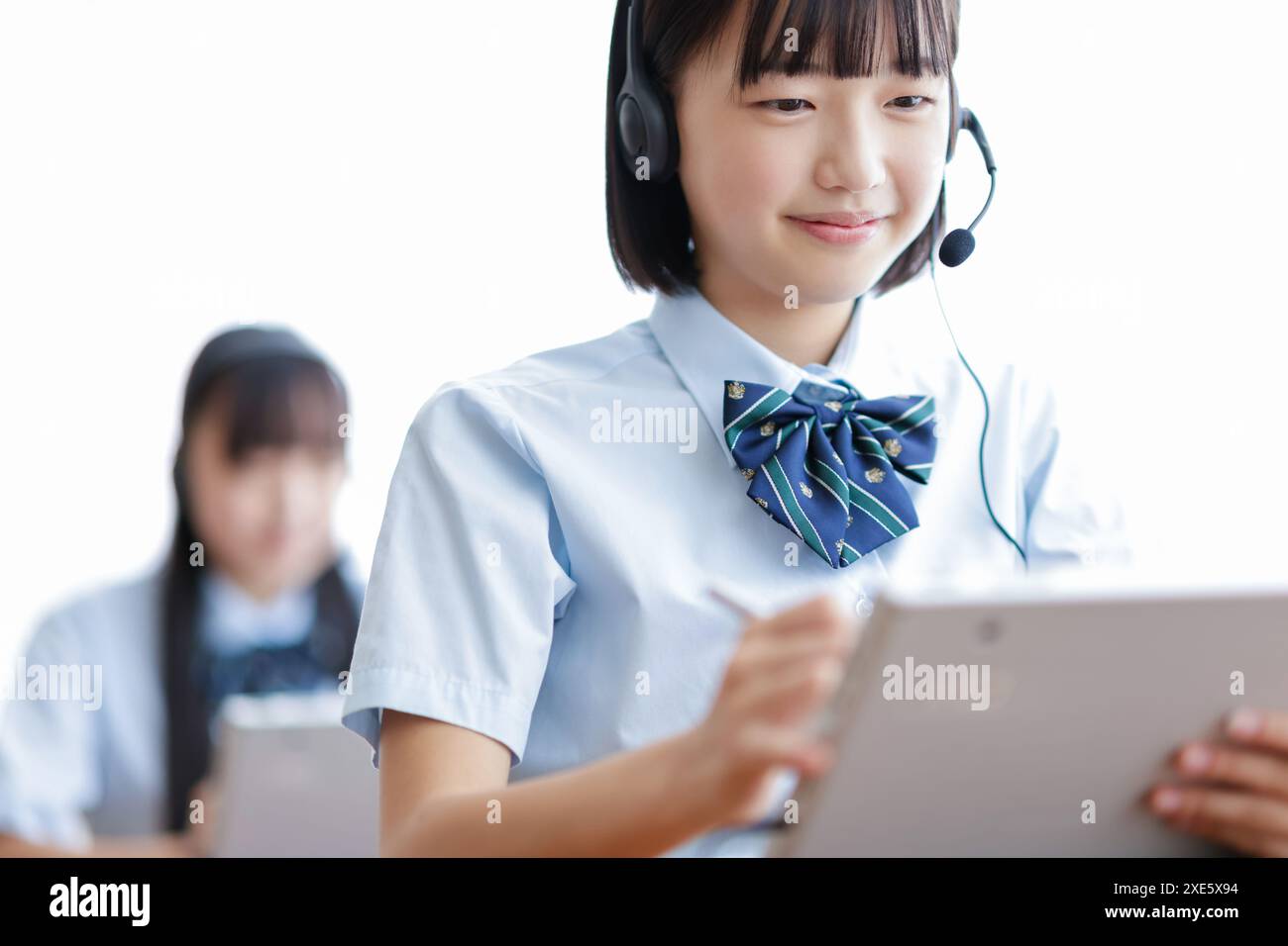 Student taking a class using a tablet Stock Photo