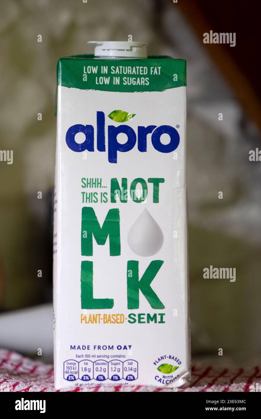 Alpro carton low-sugar low in saturated fat  long-life dairy free plant-based semi oat drink label 'This is Not Milk' in kitchen Great Britain UK 2024 Stock Photo