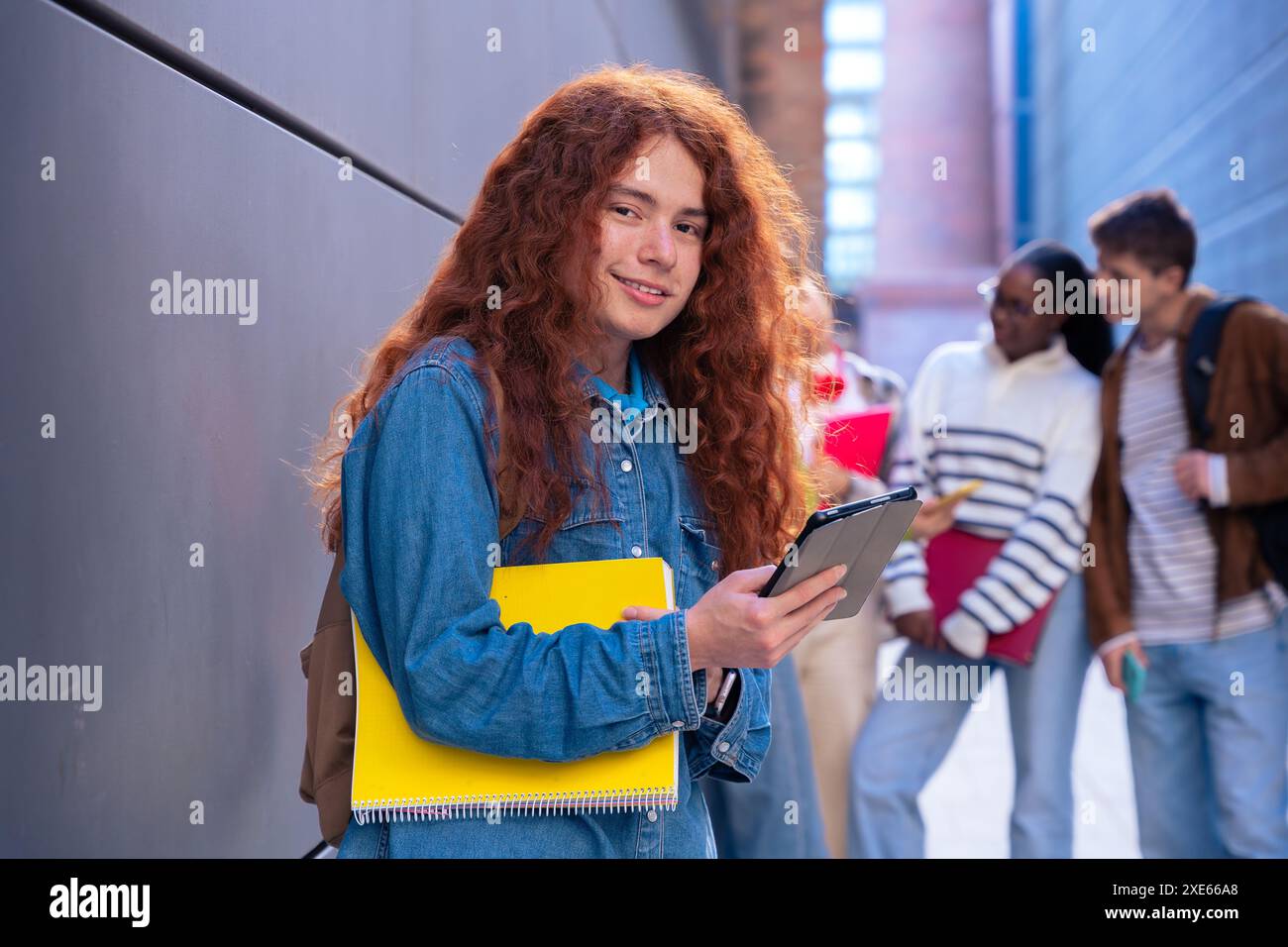 Young caucasian man browsing the internet using digital tablet outdoors. Stock Photo
