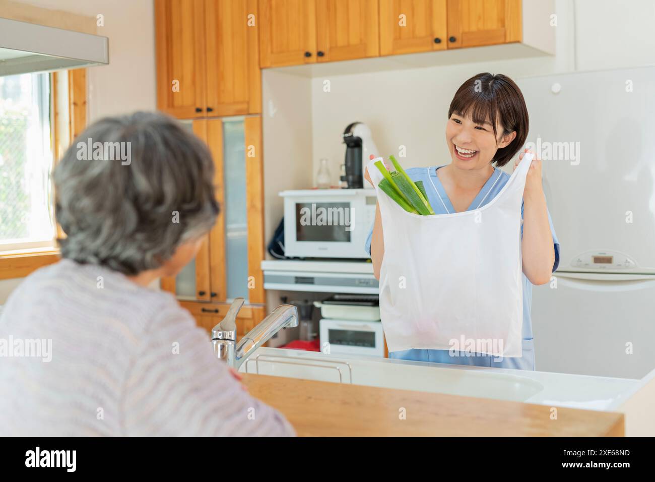 Female carer and female client doing the shopping. Stock Photo