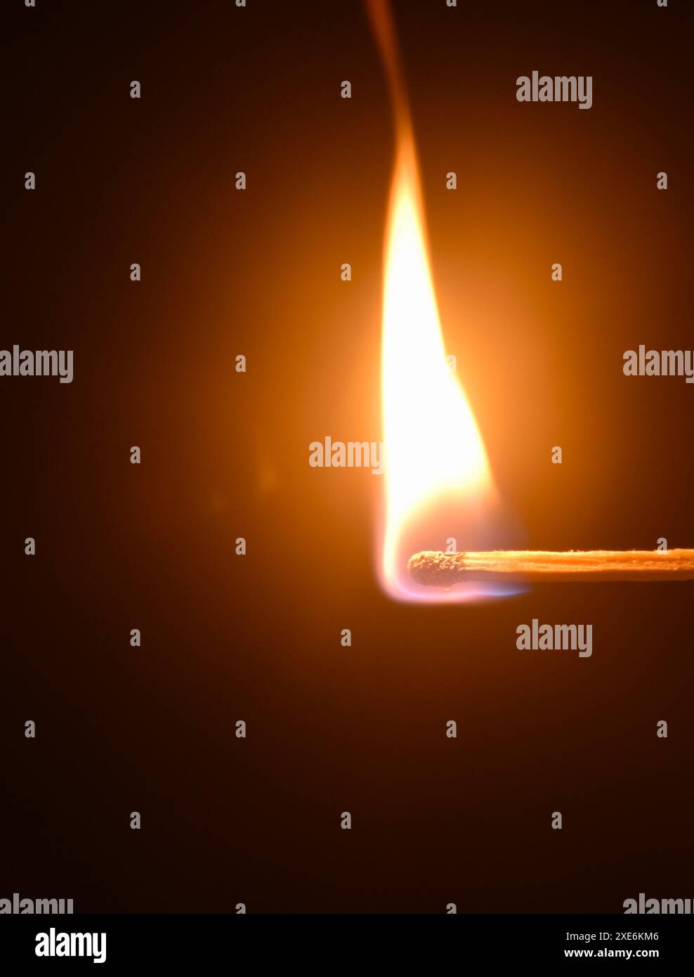 red head matchstick ignite and lighting on in dark background Stock ...