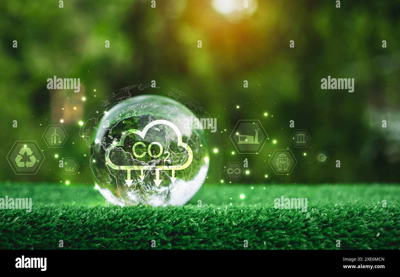 A glass sphere with a CO2 cloud on it, The sphere is surrounded by a green background with various icons and symbols, Scene is one of environmental aw Stock Photo