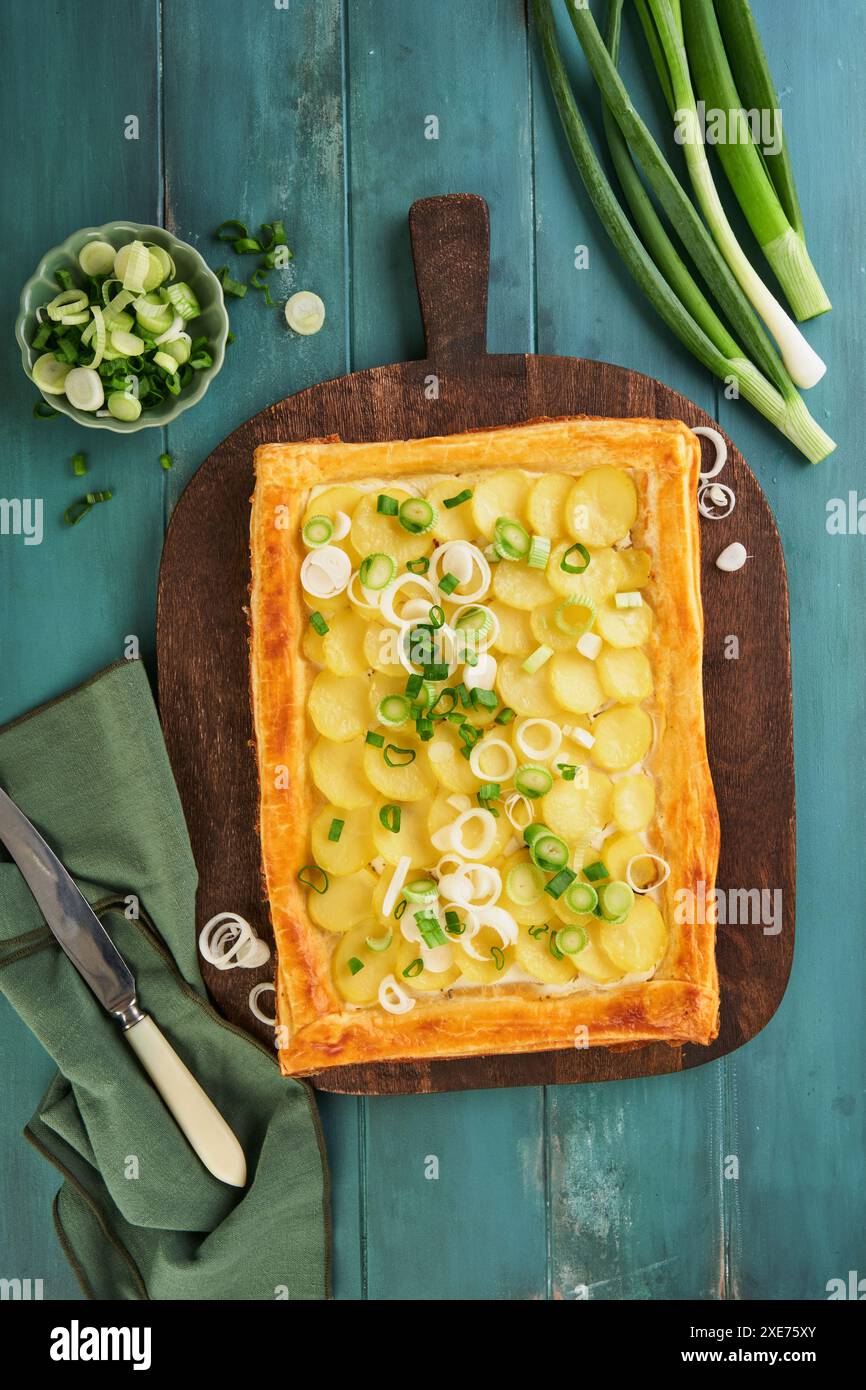 Homemade puff pastry tart or galette with potatoes, cream cheese and