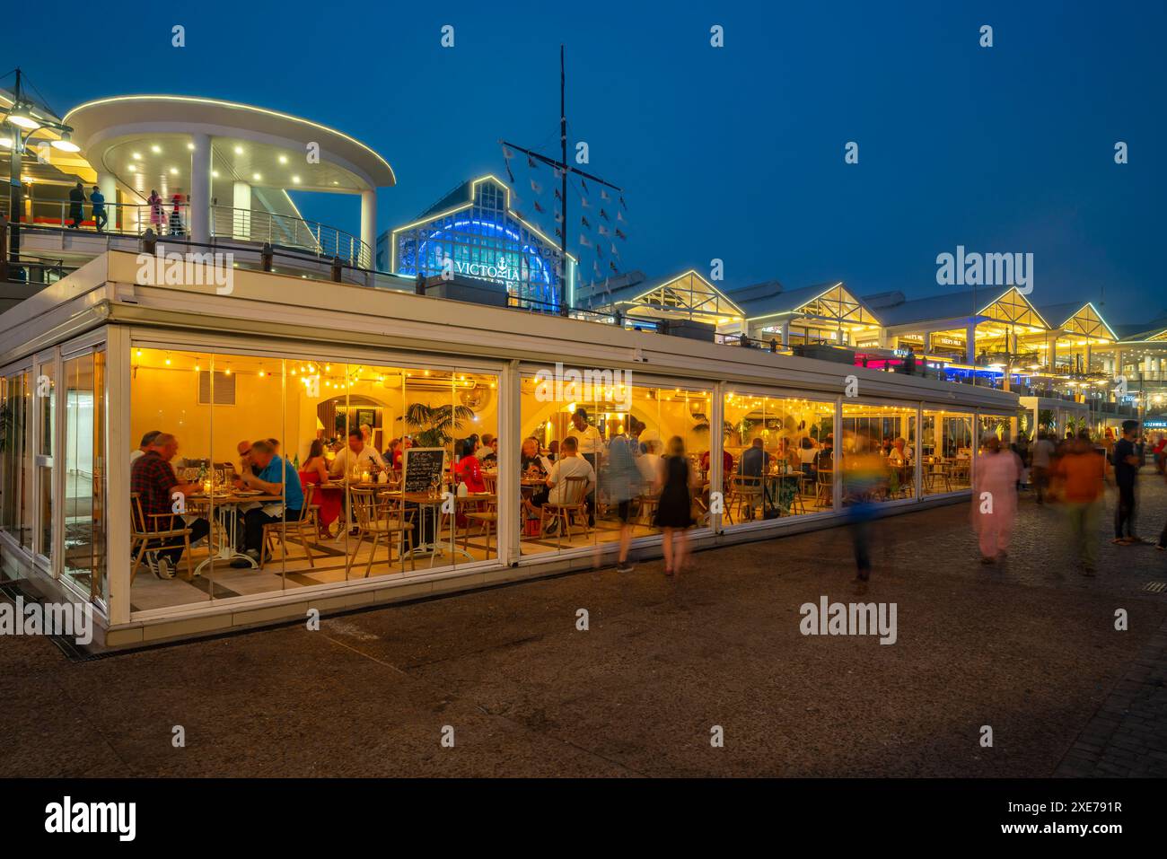 View of restaurants in the Waterfront at dusk, Cape Town, Western Cape, South Africa, Africa Stock Photo