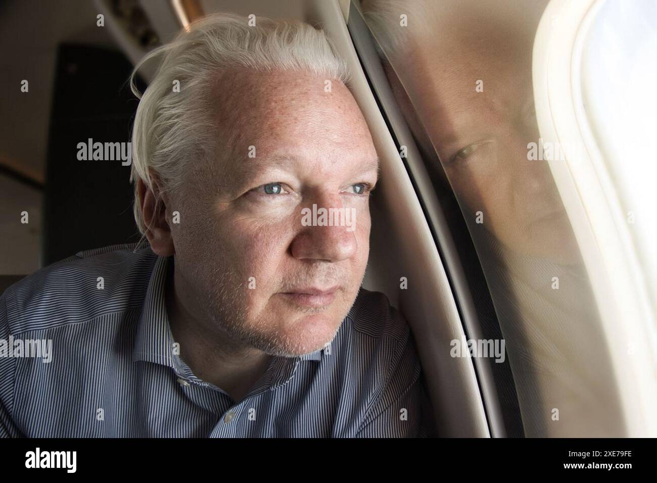 Washington, United States. 26th June, 2024. WikiLeaks founder Julian Assange is pictured on Wednesday, June 26, 2024, during his flight to his home country of Australia. Assange pleaded guilty Wednesday to a single espionage conspiracy charge inside a courtroom in the U.S. Mariana Islands to become a free man following a 14-year legal battle. The plea deal allowed Assange to be sentenced to time served. Handout Photo via Wikileaks/UPI Credit: UPI/Alamy Live News Stock Photo
