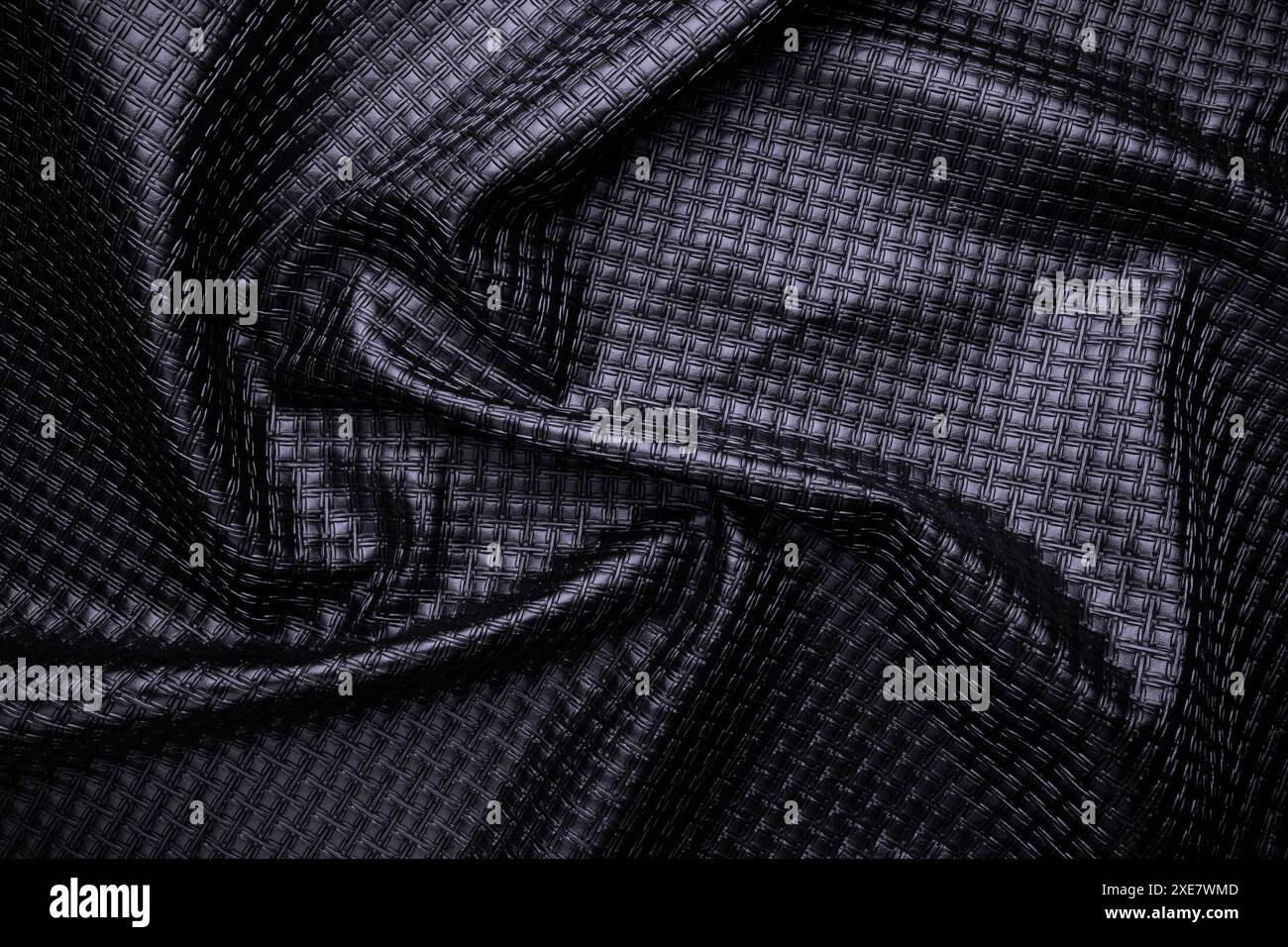 black vegan leather with pattern, fake crumpled textile texture Stock Photo