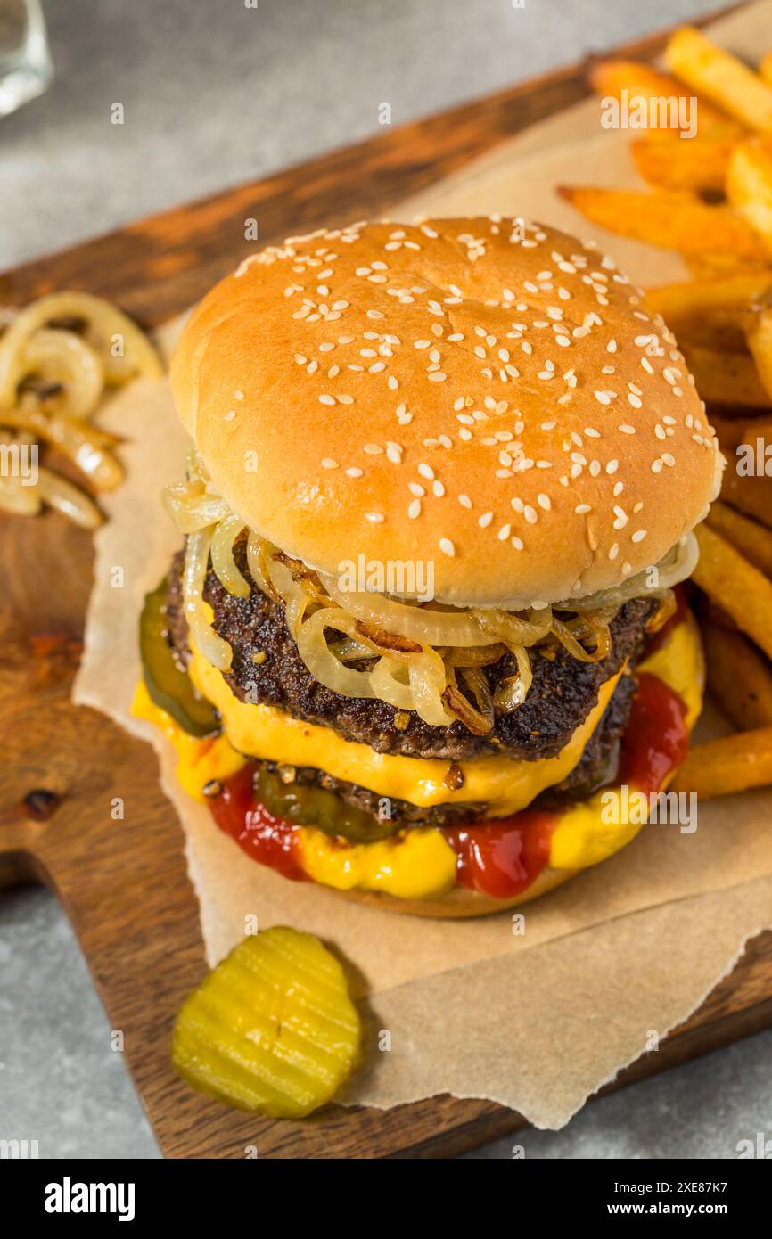 Homemade Chicago Big Baby Cheeseburger with Pickles and Onions Stock ...